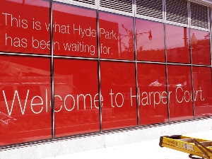 Installation of Window Decals for Harpers Court in Chicago's Hyde Park Neighborhood